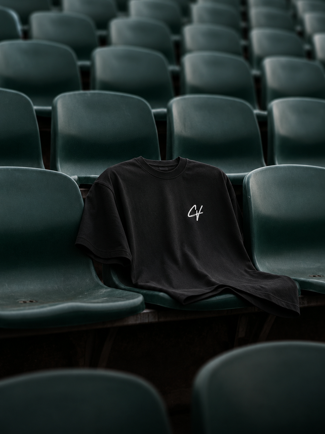 Chachi Versaci tee draped over theater seats