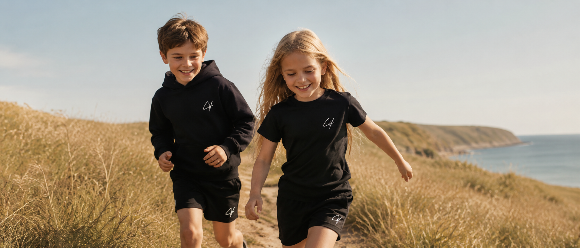 Kids running through the dunes in Chachi Versaci essentials